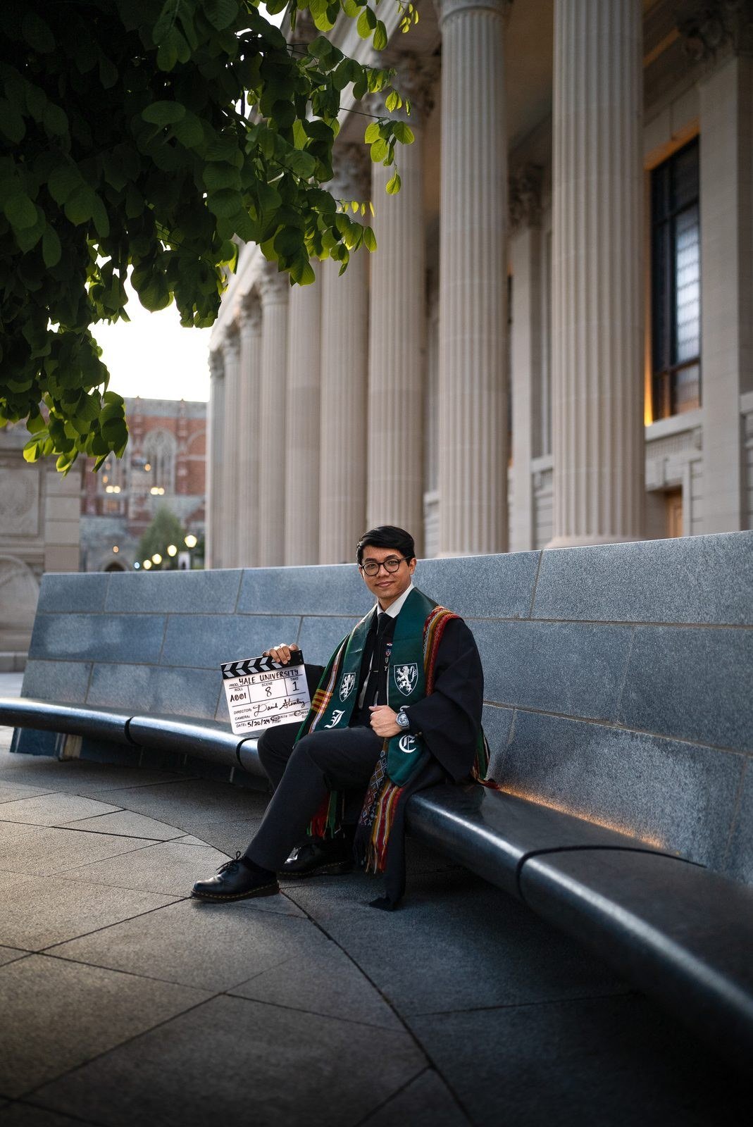 David Stanley NTM on graduation day at Yale with a clapperboard